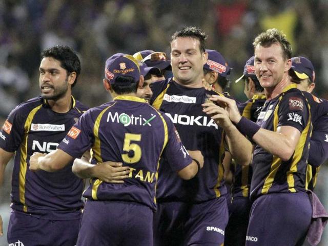 Kolkata Knight Riders' Jacques Kallis, center, Brett Lee, right, and other teammates celebrate the dismissal of Royal Challengers Bangalore's AB de Villiers, unseen, during the IPL cricket match in Kolkata. AP/Bikas Das