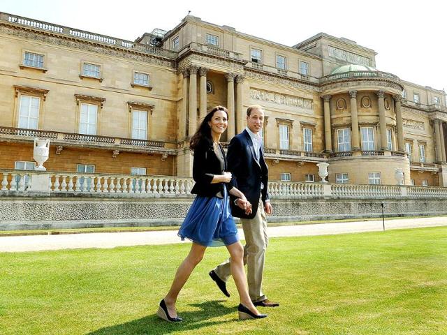 Britain's Prince William and Catherine, Duchess of Cambridge, walk together in Buckingham Palace, following their wedding in central London. (Reuters/John Stillwell/Pool)