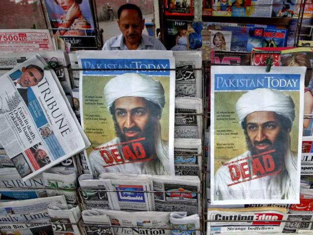 A roadside vendor sells newspapers with headlines about the death of al Qaeda leader Osama bin Laden, in Lahore May 3, 2011. Pakistan's president acknowledged for the first time on Tuesday that his security forces were left out of a US operation to kill bin Laden. (Reuters)