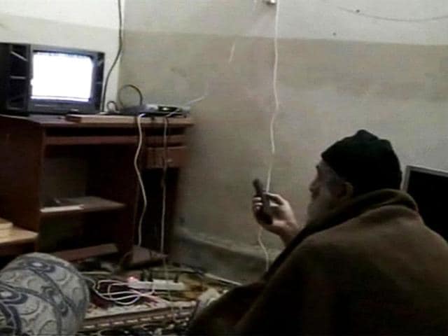 Osama bin Laden is shown watching himself on television in this video frame grab released by the US Pentagon May 7, 2011. Five videos were found in Osama's house in Abbottabad. (Reuters)
