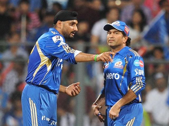 Mumbai Indians captain Harbhajan Singh (L) speaks with team mate Sachin Tendulkar during the IPL Twenty20 cricket match against Deccan Chargers at the Wankhede Stadium in Mumbai. AFP/Punit Paranjpe