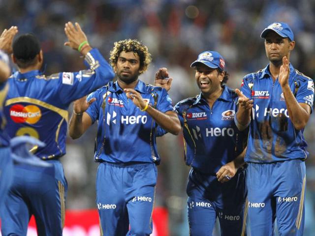Mumbai Indians players Sachin Tendulkar and Lasith Malinga celebrate the wicket of Deccan Chargers' Cameron White during the match at Wankhede Stadium. HT/Kunal Patil