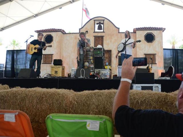 Mandolin player Wayne Gottstine (L), gas tank bass player Jeff Eaton (C) and banjo player Eric Mardis of Split Lip Rayfield perform on stage at the Stagecoach Country Music Festival at The Empire Polo Club in Indio, California. AFP Photo/Robyn Beck