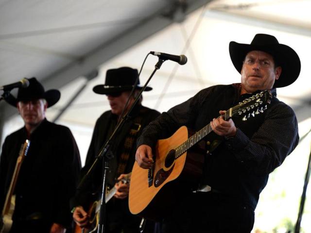 The Unforgiven, with lead singer Steve “John Henry” Jones (R), performs on stage at the Stagecoach Country Music Festival at The Empire Polo Club in Indio, California. AFP Photo/Robyn Beck