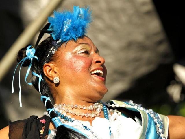 Jennifer Jones dances with the Treme Brass band at a sunrise concert marking International Jazz Day in New Orleans. AP Photo/Gerald Herbert