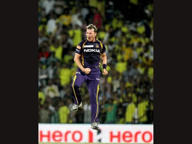 Kolkata Knight Riders' Brett Lee celebrates the wicket of Chennai Super Kings opener Michael Hussey during their IPL5 match in Chennai. PTI/R Senthil Kumar