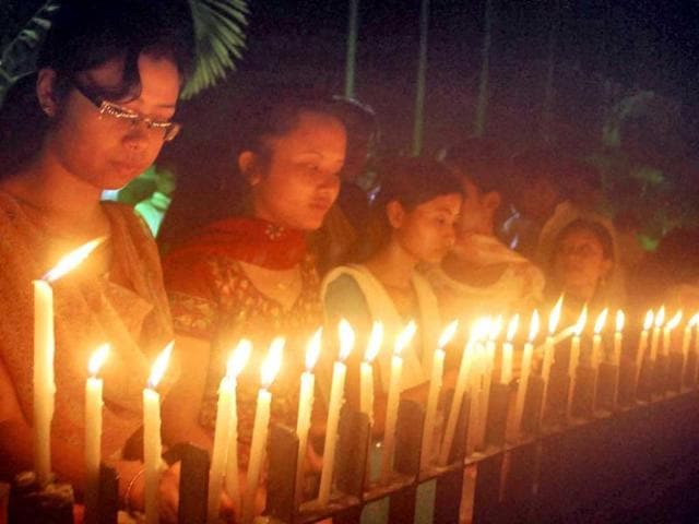 Members of National Students Union of India and Assam Pradesh Youth Congress jointly observe a candle vigil for the victims of the ferry disaster in the Brahmaputra river, in Guwahati. PTI Photo