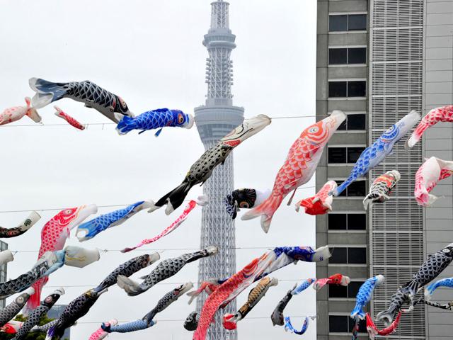 Some 450 colorful carp streamers fly before the world's highest radio tower, the Tokyo Sky Tree at a Tokyo park. Koinobori or carp streamers are displayed for May 5 Boy's Festival in Japan, that reflect the parents' wishes for boys to grow up as strong as the carp. AFP/Yoshikazu Tsuno