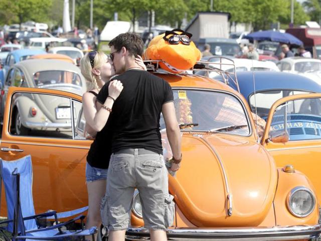 A couple kiss as they attend the 29th annual "MaiKaeferTreffen" (May Beetle meeting) meeting in Hanover. (Reuters/Tobias Schwarz)