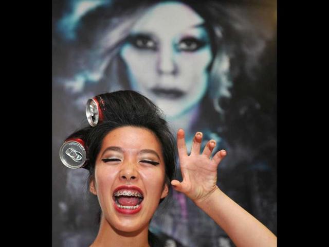 A fan of US pop diva Lady Gaga strikes a pose before her concert in Hong Kong. AFP Photo/Laurent Fievet