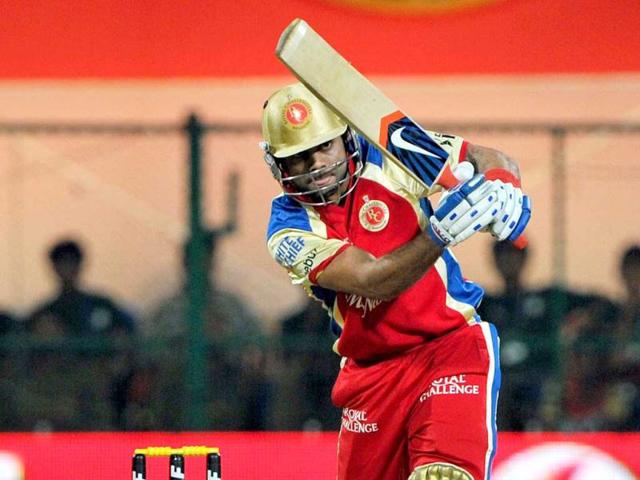Royal Challengers Bangalore batsman Virat Kohli plays a shot during the IPL Twenty20 cricket match between Royal Challenger Bangalore and Kings XI Punjab at the M. Chinnaswamy Stadium in Bangalore. AFP Photo/Manjunath Kiran
