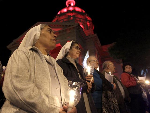Franciscan Sisters participate in a procession on the eve of Kurusu Ara, or the Day of the Cross, in Asuncion. REUTERS/Jorge Adorno