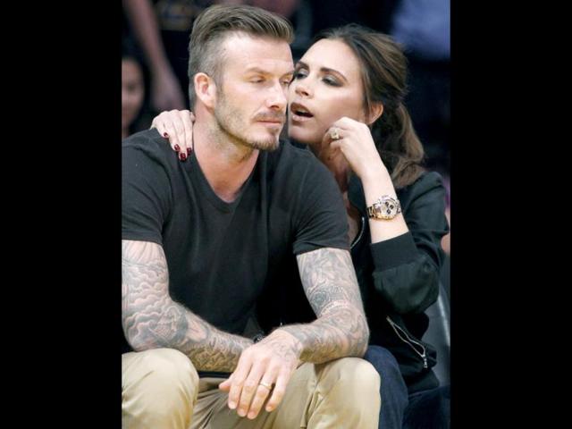 The 38-year-old could be seen whispering to her sports star husband, rather than watching the action on court.