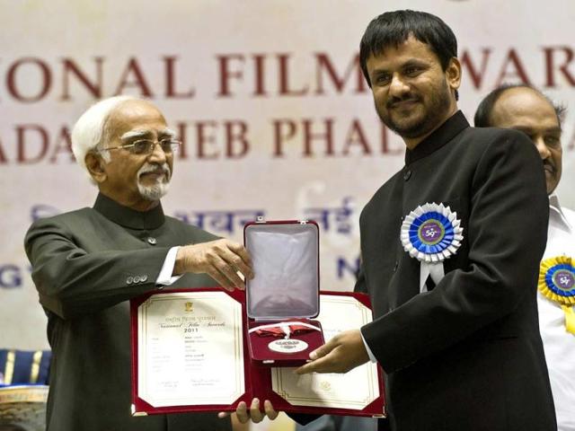 Hamid Ansari presents the best Actor award to Girish Kulkarni during the 59th National Film Award. (AFP Photo) Hamid Ansari presents the best Actor award to Girish Kulkarni during the 59th National Film Award. (AFP Photo)