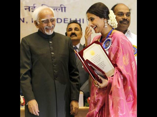 Vidya smiles onstage as she receives the award. (AP Photo) Vidya smiles onstage as she receives the award. (AP Photo)