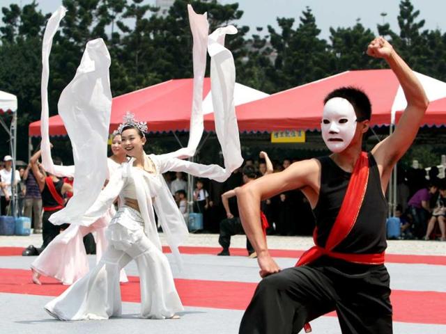 Taiwanese people perform Chinese kung fu at the Chiang Kai-shek Memorial Hall during a kung fu event in Taipei, Taiwan. AP Photo/Chiang Ying-ying