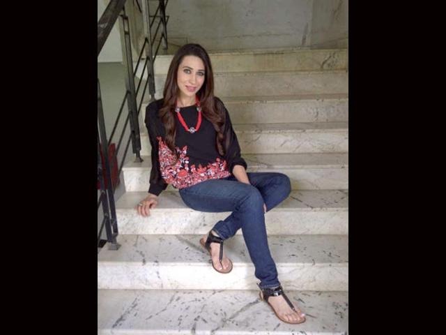 Karisma was dressed in black and blue.