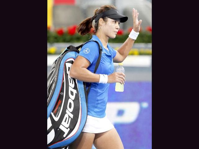Li Na from China waves after winning over Garbine Muguruza Blanco of Spain at the Madrid Open Tennis tournament in Madrid. AP/Andres Kudacki