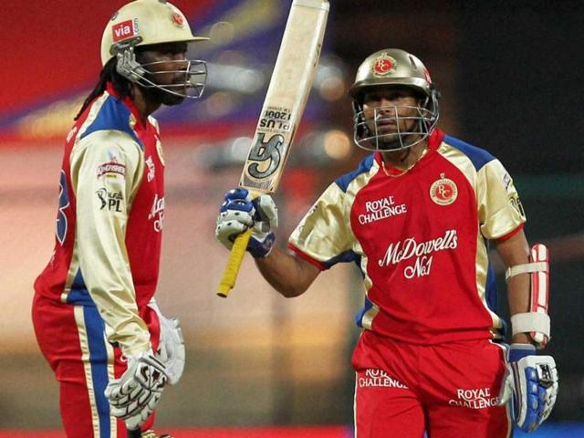 Royal Challengers Bangalore's T Dilshan celebrates his fifty runs against Deccan Chargers during the IPL 5 match in Bengaluru on Sunday. PTI Photo/Shailendra Bhojak