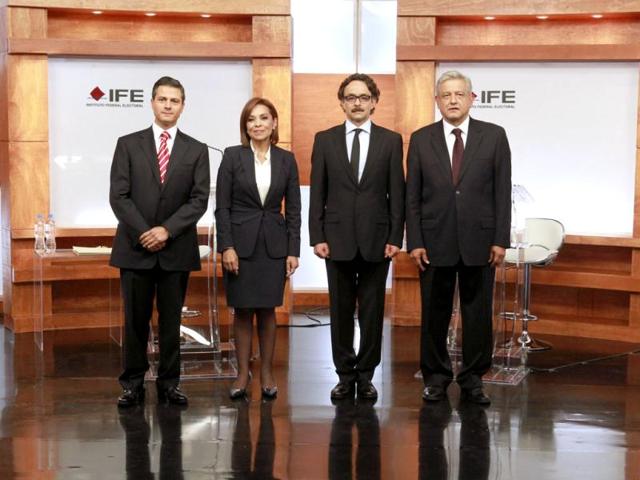 In this photo released by Mexico's Federal Electoral Institute (IFE), presidential candidates (L to R) Enrique Pena Nieto (Revolutionary Institutional Party, PRI), Josefina Vazquez Mota (National Action Party, PAN), Gabriel Quadri (New Alliance Party, PANAL) and Andres Manuel Lopez Obrador (Democratic Revolution Party and Workers Party, PRD,PT) pose for a group photo prior to the start of the first presidential debate in Mexico City. AP Photo/IFE