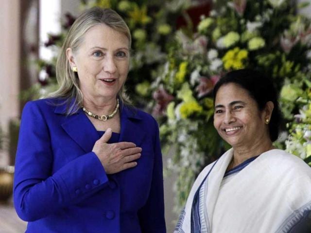 US secretary of State Hillary Rodham Clinton, left, gestures beside West Bengal chief minister Mamata Banerjee before a meeting in Kolkata. (AP Photo/Bikas Das)