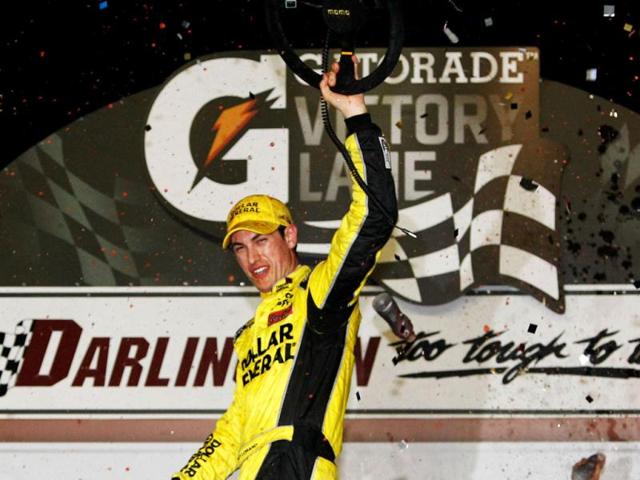 Joey Logano, driver of the #20 Dollar General Toyota, celebrates in Victory Lane after winning the NASCAR Nationwide Series VFW Sport Clips Help A Hero 200 at Darlington Raceway in Darlington, South Carolina. AFP/Tom Pennington