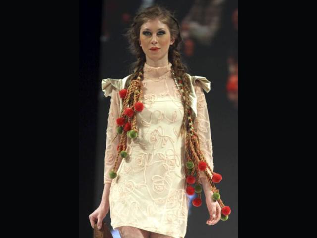A model presents a creation inspired by native Indian culture by Colombian designer Bertha Henriquez during the "Circle of Fashion" show in Bogota. Reuters/Fredy Builes