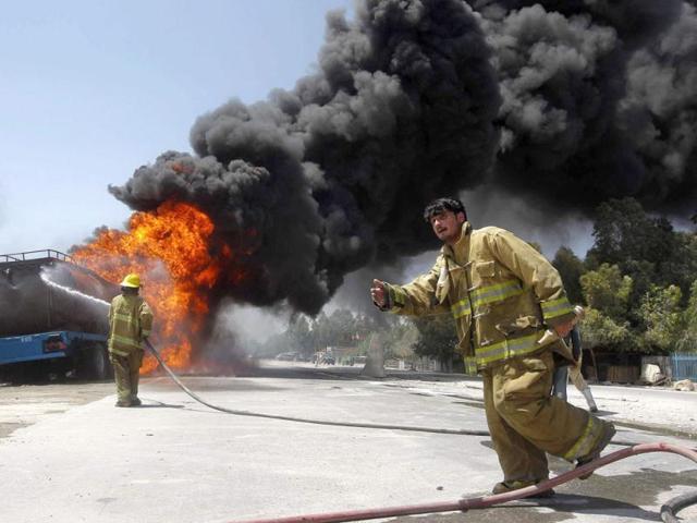 Firefighters spray water on a burning fuel tanker which caught fire after a bomb planted in it detonated in the city of Jalalabad, Nangarhar province. No casualties have been reported as yet, according to an official. Reuters
