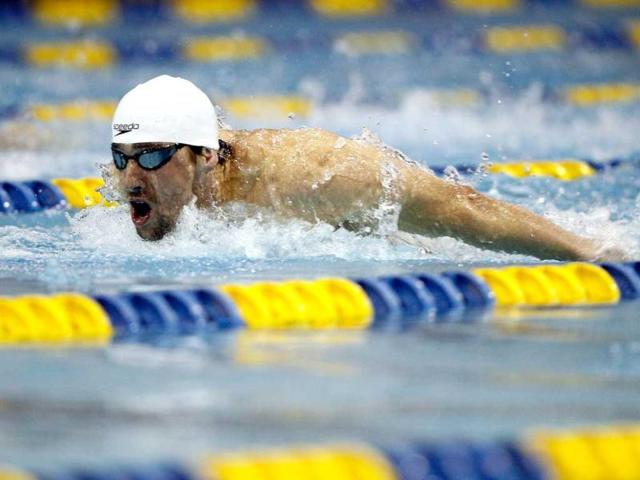 Michael Phelps competes in the men's 200m butterfly finals of the 2012 Charlotte UltraSwim Grand Prix at Mecklenburg County Aquatic Center in Charlotte. AFP/Streeter Lecka
