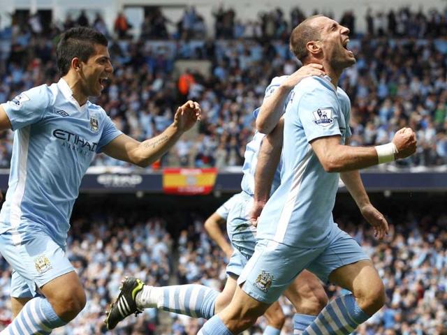 Manchester City's Pablo Zabaleta (R) and Sergio Aguero celebrate Zabaleta's goal during their English Premier League soccer match against Queens Park Rangers at the Etihad Stadium in Manchester, northern England. Reuters/Darren Staples Manchester City's Pablo Zabaleta (R) and Sergio Aguero celebrate Zabaleta's goal during their English Premier League soccer match against Queens Park Rangers at the Etihad Stadium in Manchester, northern England. Reuters/Darren Staples