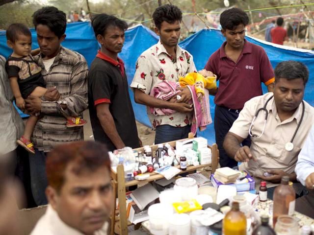 Myanmar refugees from the Rohingya community, a predominantly Muslim sect in Myanmar, wait for medical care at a makeshift refugee camp in New Delhi. AFP PHOTO/ Andrew Caballero-Reynolds