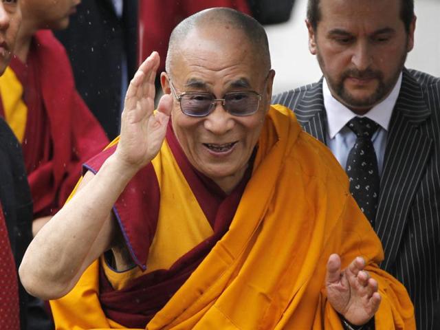 Tibetan Buddhist spiritual leader, Dalai Lama arrives at St. Paul's Cathedral in London to receive the 2012 Templeton Prize awarded to him for encouraging scientific research and harmony among religions. AP Photo/Sang Tan