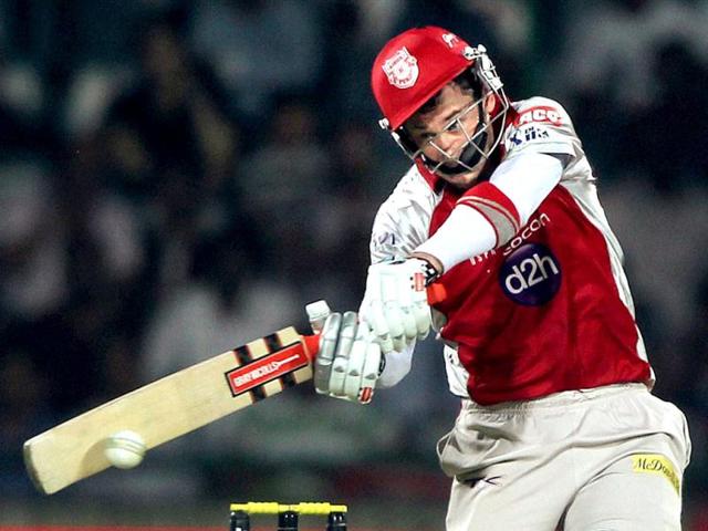 Kings XI Punjab's David Hussey plays a shot against Delhi Daredevils during their IPL-5 match in New Delhi. PTI Photo/Aman Sharma