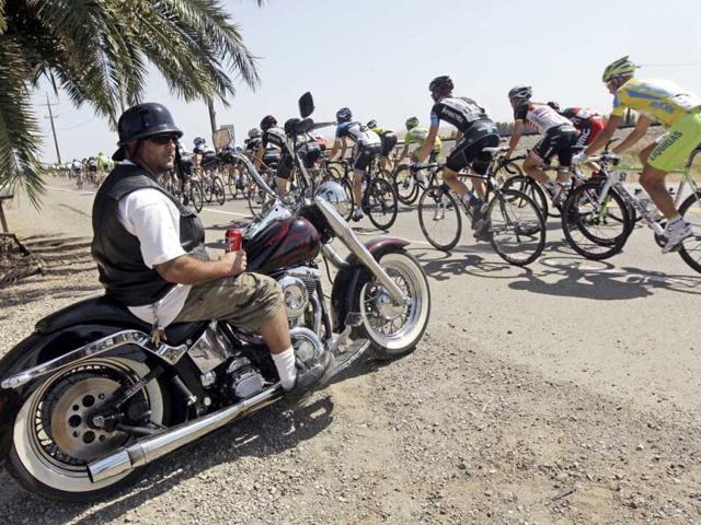 Ronnie Perry, of Brentwood, watches the peloton, including race leader Peter Sagan of Slovakia, ride past during Stage 3 of the Tour of California cycling race in Byron. AP/Marcio Jose Sanchez