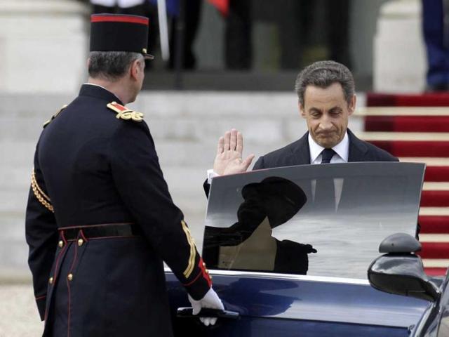 Outgoing French president Nicolas Sarkozy leaves the Elysee Palace after the handover ceremony with new President Francois Hollande in Paris. AP/Michel Euler