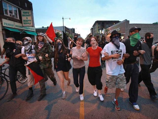 Protestors march in a rally against police brutality in Chicago, Illinois. This was the second day of protests in what is expected to be a full week of demonstrations as the city prepares to host the NATO Summit May 20-21. (AFP Photo)