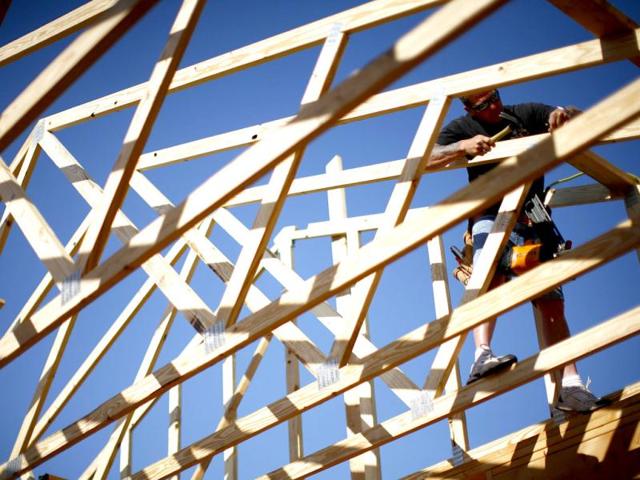 Workers construct a home in Joplin, Missouri. May 22 marks the one year anniversary of a deadly EF-5 tornado that ripped through the town, killing 161 people. Reuters/Eric Thayer