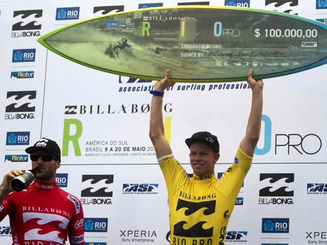 US' surfer John John Florence, of Hawaii, right, celebrates winning the final, over Australia's Joel Parkinson, left, at the Association of Surfing Professionals (ASP) Billabong Rio Pro surfing competition on Barra da Tijuca beach in Rio de Janeiro, Brazil. (AP Photo/Felipe Dana)