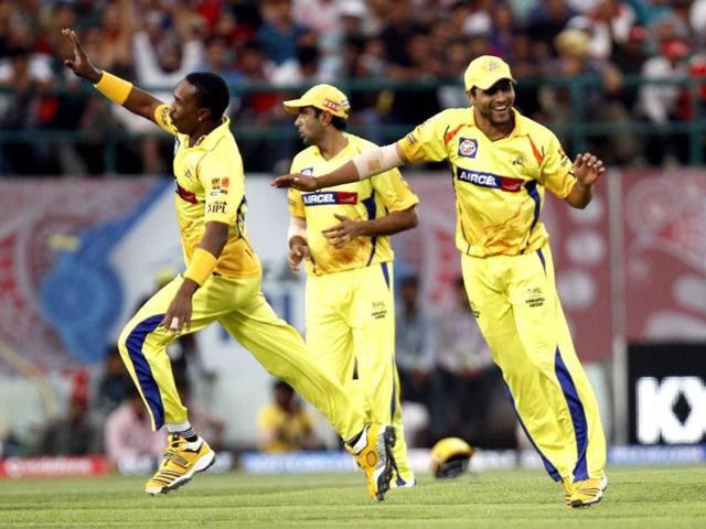 Dwayne Bravo of Chennai Super Kings celebrating with other team players after taking the wicket of David Hussey of Kings XI Punjab during the IPL Twenty 20 cricket match at HPCA stadium, Dharamsala. HT Photo