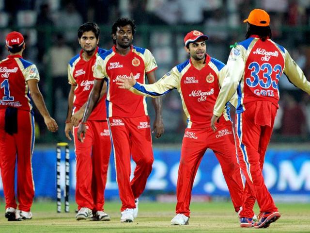 Royal Challengers Bangalore cricketers celebrate after winning the IPL Twenty20 cricket match vs Delhi Daredevils at the Feroz Shah Kotla stadium in New Delhi. AFP Photo/Manan Vatsyayana
