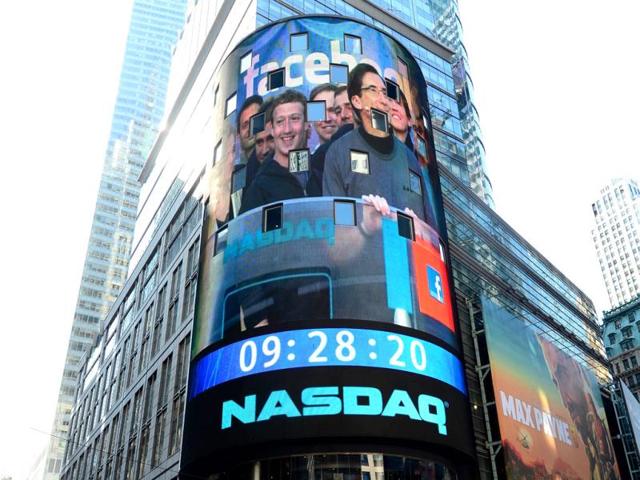 Facebook-co-founder-Mark-Zukerberg-is-seen-on-a-screen-getting-ready-to-ring-the-Nasdaq-stock-exchange-opening-bell-in-Times-Square-in-New-York-AFP-Emmanuel-Dunand Facebook-co-founder-Mark-Zukerberg-is-seen-on-a-screen-getting-ready-to-ring-the-Nasdaq-stock-exchange-opening-bell-in-Times-Square-in-New-York-AFP-Emmanuel-Dunand