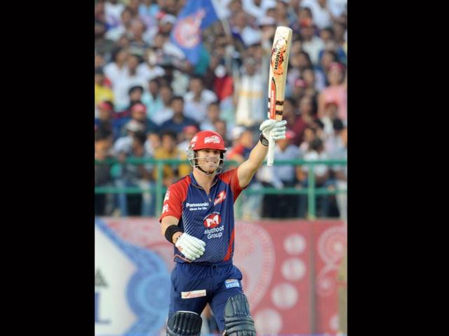Delhi Daredevils player David Warner waves his bat after scoring a half century from 25 balls during the IPL Twenty20 cricket match between Kings XI Punjab and Delhi Daredevils at the Himachal Pradesh Cricket stadium in Dharamsala . AFP Photo/Raveendran