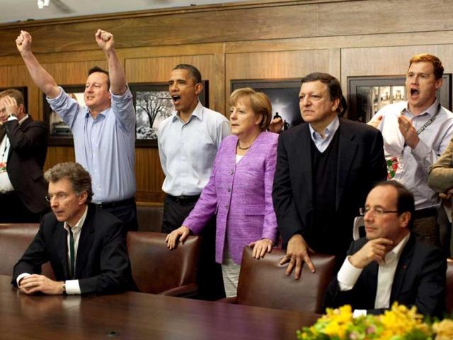 Prime Minister David Cameron of Britain (centre L-R), US President Barack Obama, Chancellor Angela Merkel of Germany, EU president Jose Manuel Barroso and others watch the overtime shootout of the Chelsea vs Bayern Munich UEFA Champions League final in the Laurel Cabin conference room during the G8 Summit at Camp David, Maryland. Reuters/White House/Pete Souza/Pool