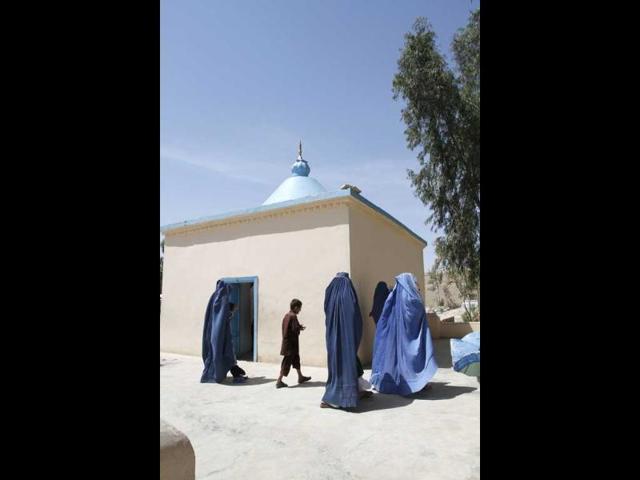 Afghans visit the Mia Ali Baba Shrine in Jalalabad, Afghanistan. For 300 years, the shrine keepers have been taking in the mentally ill. AP/Rahmat Gul