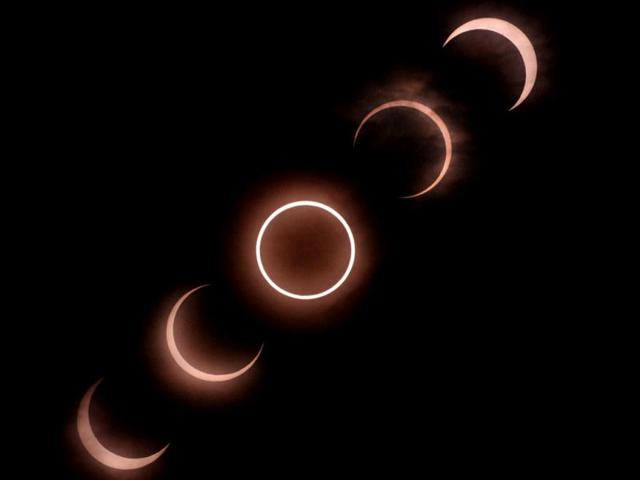 This combination picture shows an annular solar eclipse seen from Tokyo. For the first time in 932 years, a swathe of the country was able to see the annular solar eclipse, when the moon passes in front of the sun, blocking out all but an outer circle of light. AFP Photo / Kazuhiro Nogi