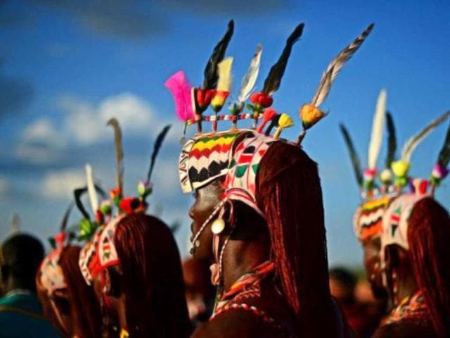 Men from the Rendille tribe take part in the Lake Turkana Festival in Loiyangalani, near Lake Turkarna, Northern Kenya. The Lake Turkana Festival is an annual cultural event designed to promote tourism in the area and to forge better relationships between the seven different tribes of the area. (AFP Photo)