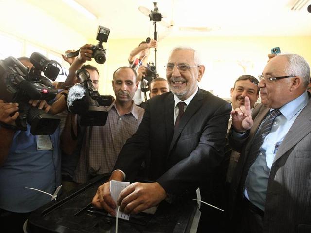 Egyptian moderate Islamist presidential candidate Abdel Moneim Abul Fotouh casts his ballot at a polling station in Cairo during the country's historic presidential election, the first since a popular uprising toppled Hosni Mubarak. AFP/Khaled Desouki