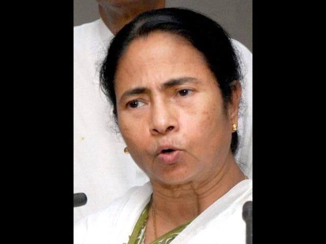 West Bengal chief minister Mamata Banerjee shows market data during the press conference regarding the price hike of petrol, in Kolkata. PTI photo