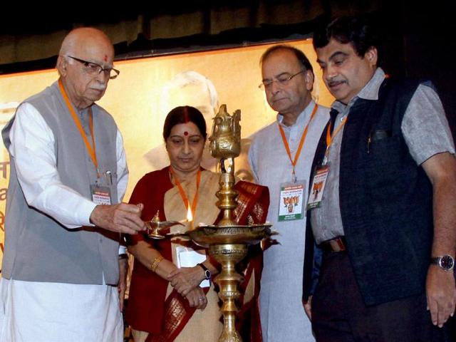 Senior BJP leader LK Advani with Nitin Gadkari, Sushma Swaraj and Arun Jaitley lights the lamp during the inauguration of the party's National Executive Meeting in Mumbai. PTI/Mitesh Bhuvad