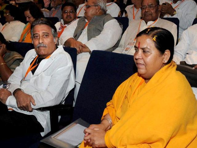 BJP leaders Uma Bharti and Vinod Khanna during the party's national executive meeting in Mumbai. PTI photo